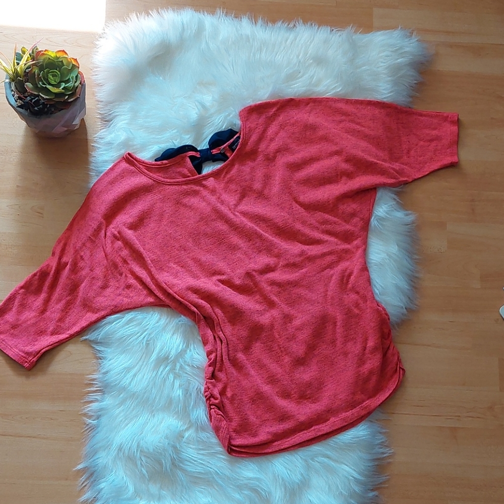 Cute light sweater with bow in back